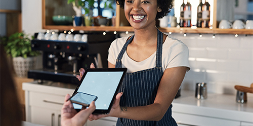 Girl smiling with tablet in her hand