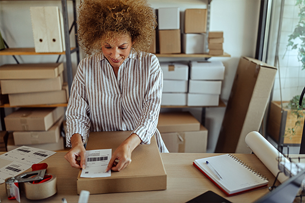 Girl making a shipping label