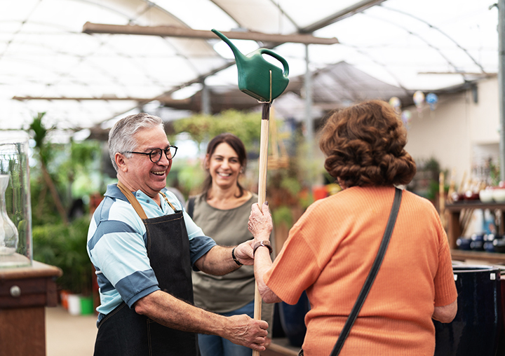 Three people talking and smiling