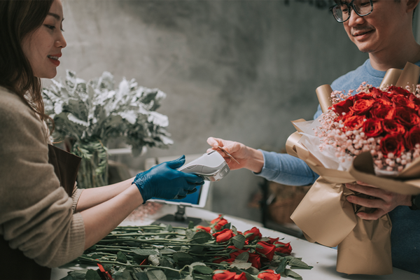 Girl buying flowers