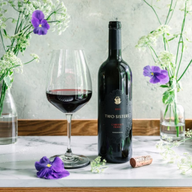 Burning Kin Winery - Holding Wine Bottles