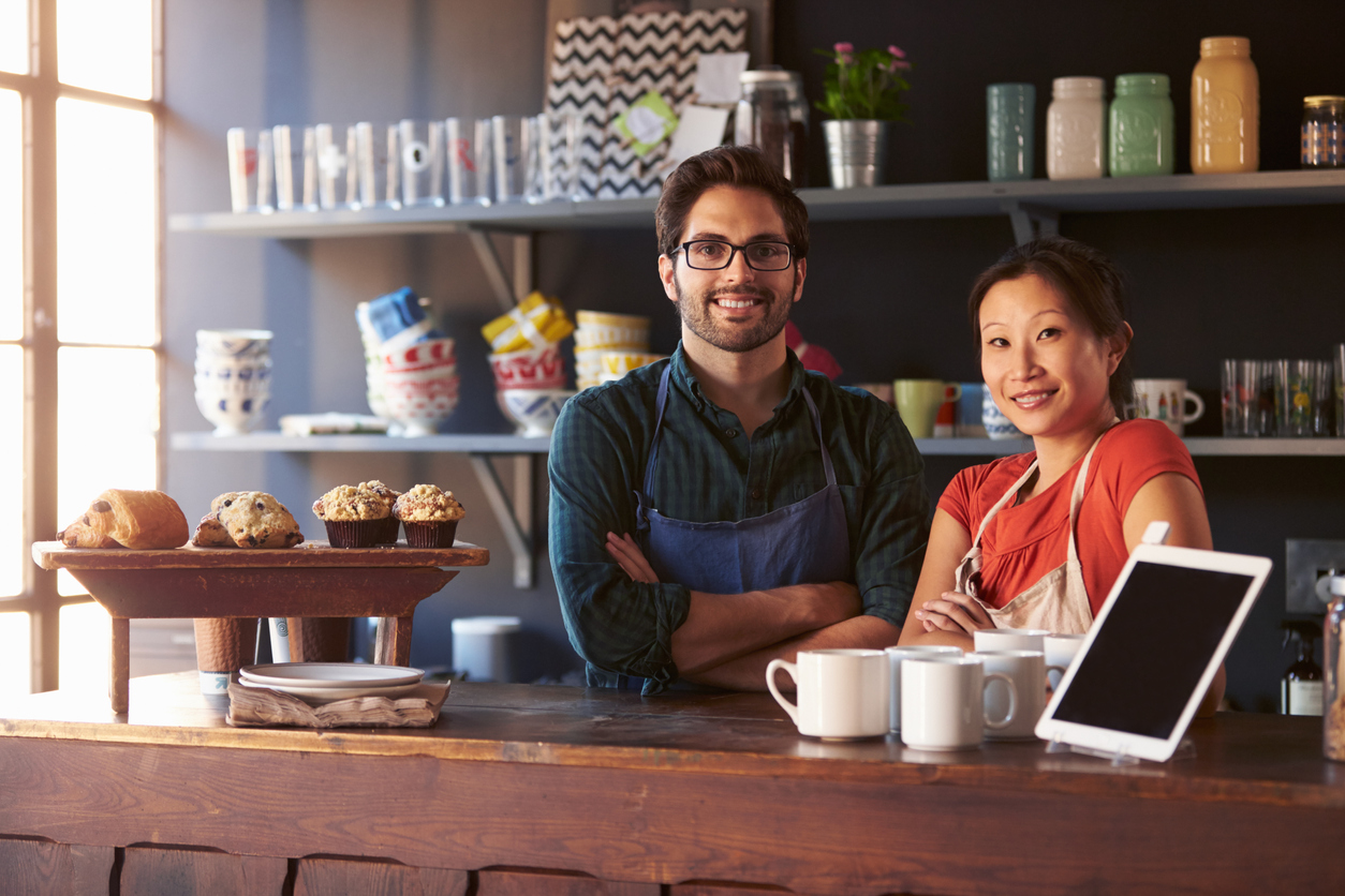 Merchants smiling at counter