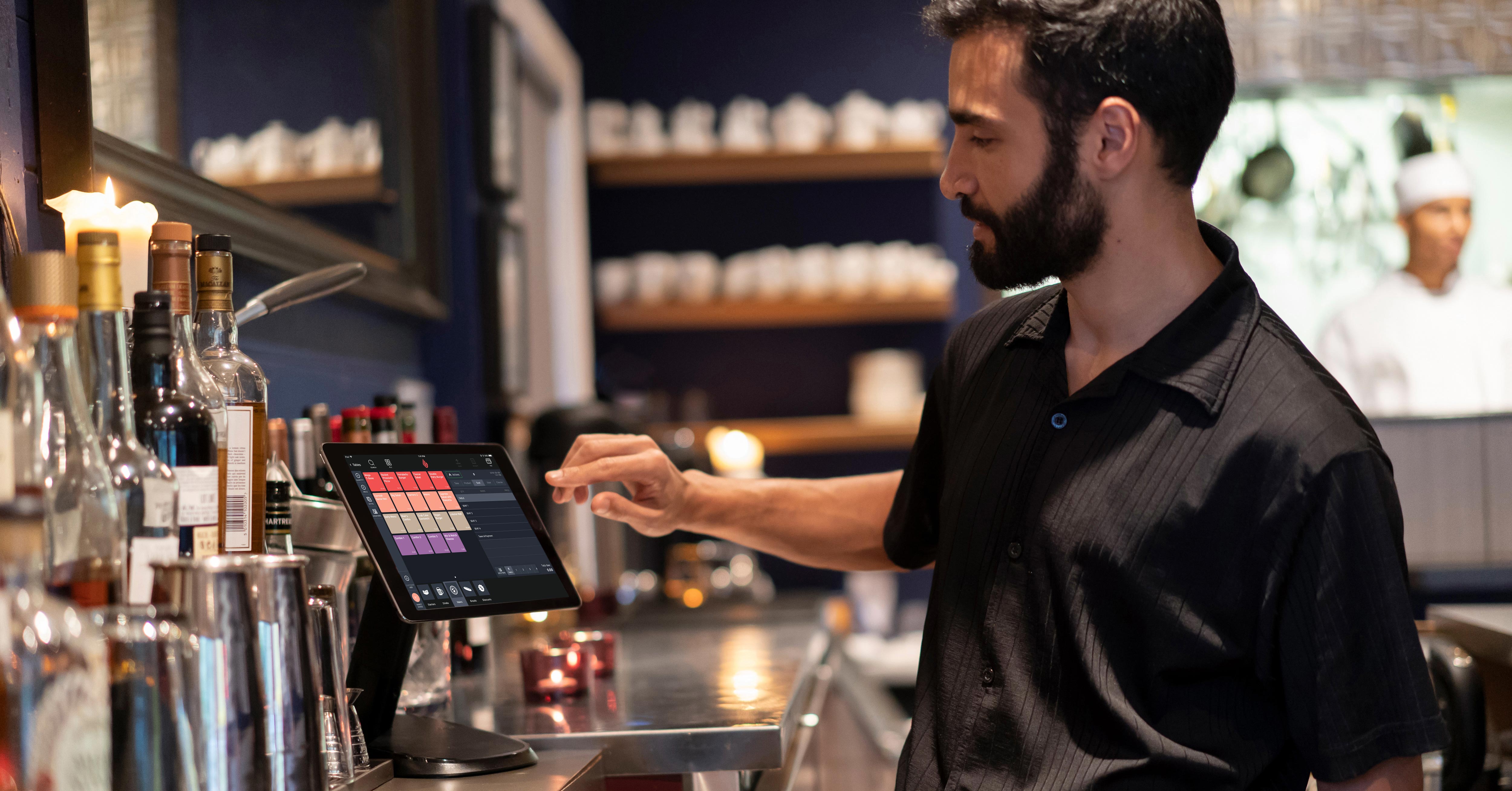 Restaurant worker using iPad POS