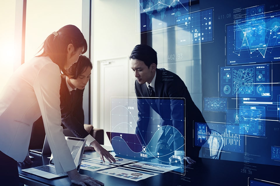 Careers related image with three business people reviewing documents in a board room