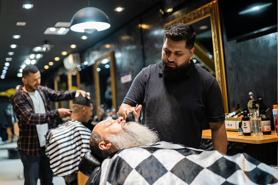 Subpage Banner for Moneris Professional Services featuring a barber shop