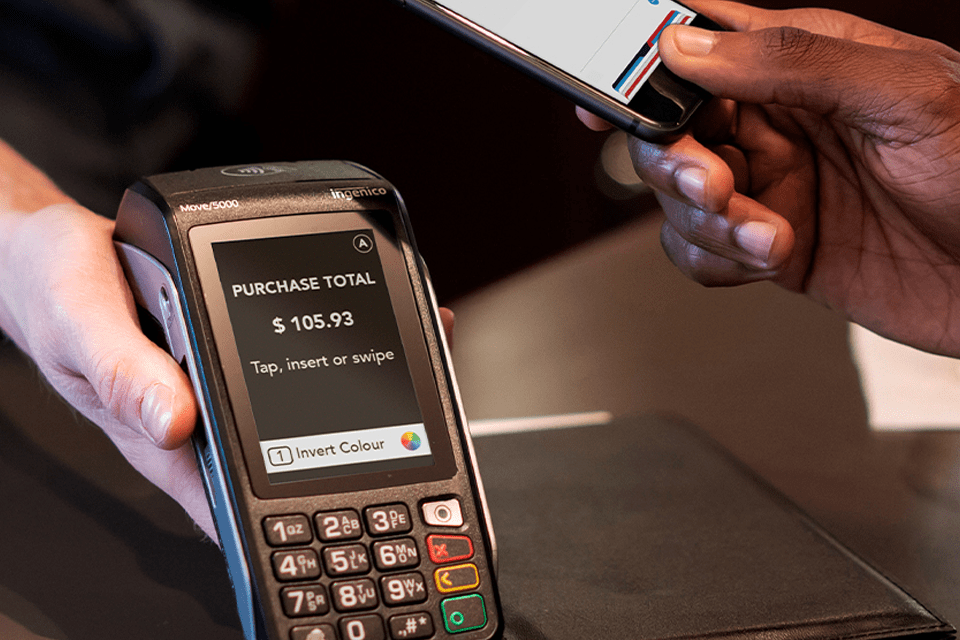 Closeup of someone making a mobile payment on a Moneris Core device set to accessibility mode